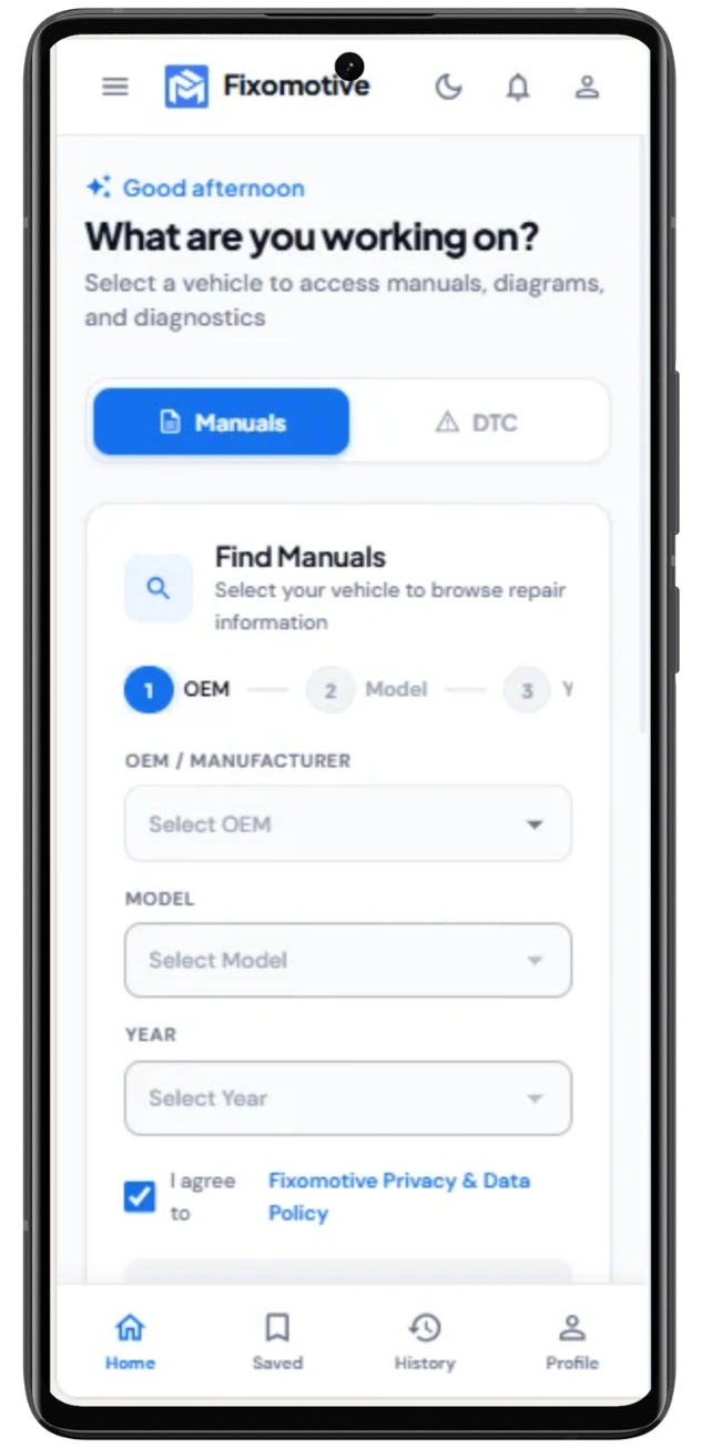 A smartphone mockup displaying the mobile app interface of the Fixomotive automotive repair platform. The screen shows the 'Find Manuals' search tool with dropdown options to select OEM, Model, and Year under the heading "What are you working on?". The interface includes a top header with the logo and user icons, and a bottom navigation bar featuring Home, Saved, History, and Profile tabs.